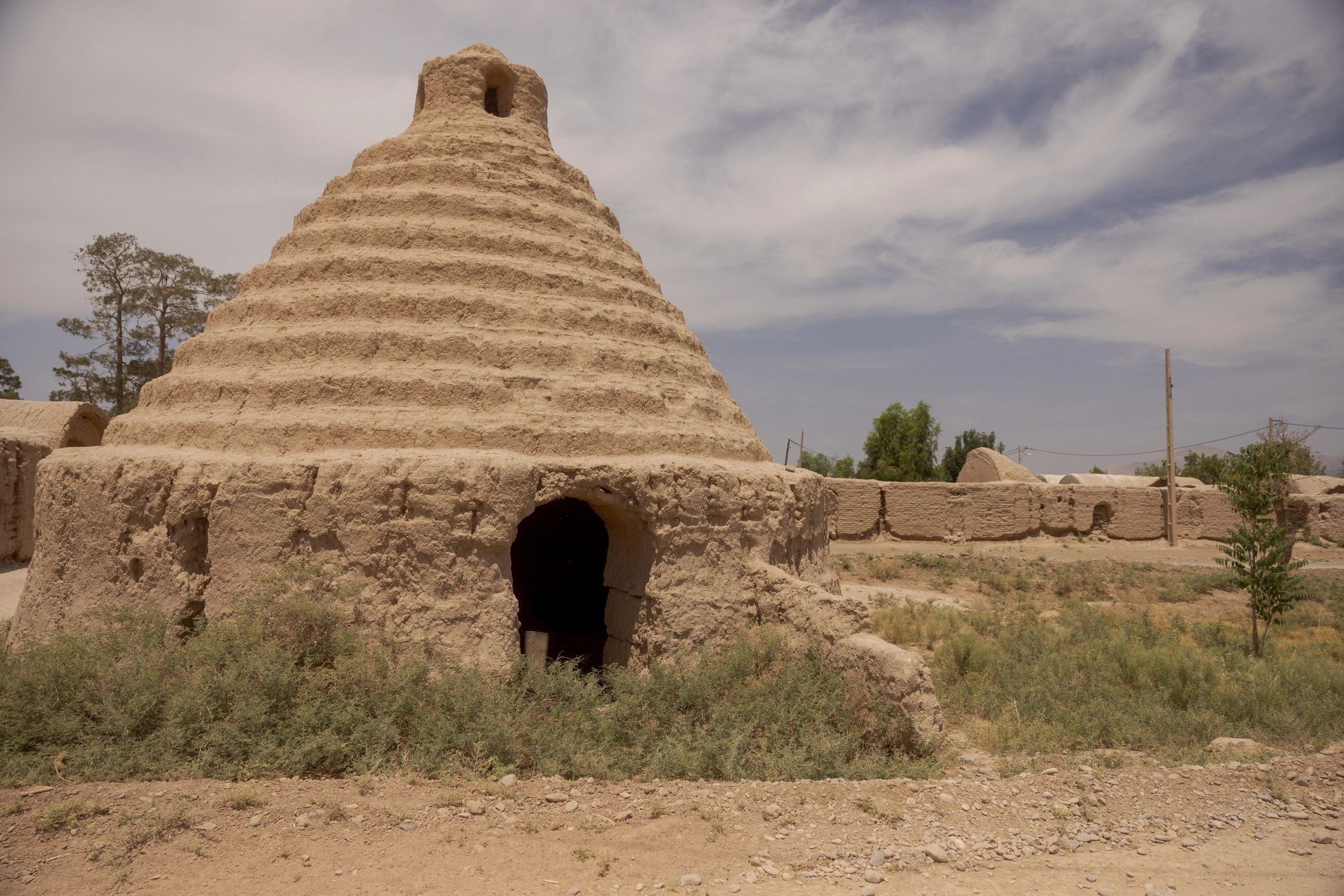 Historic mudbrick cistern in a rural Silk Road landscape